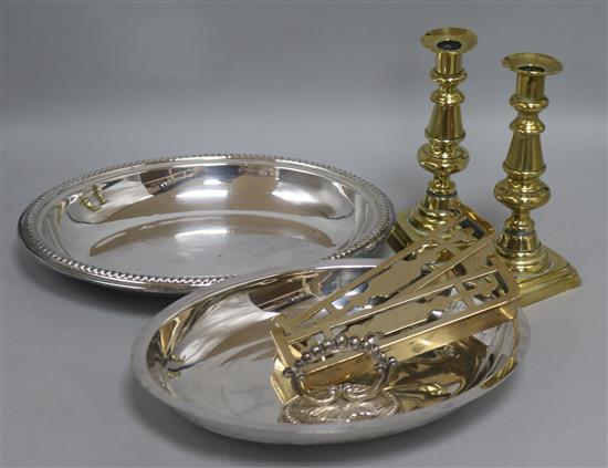 A pair of brass candlesticks, plated entree dish etc